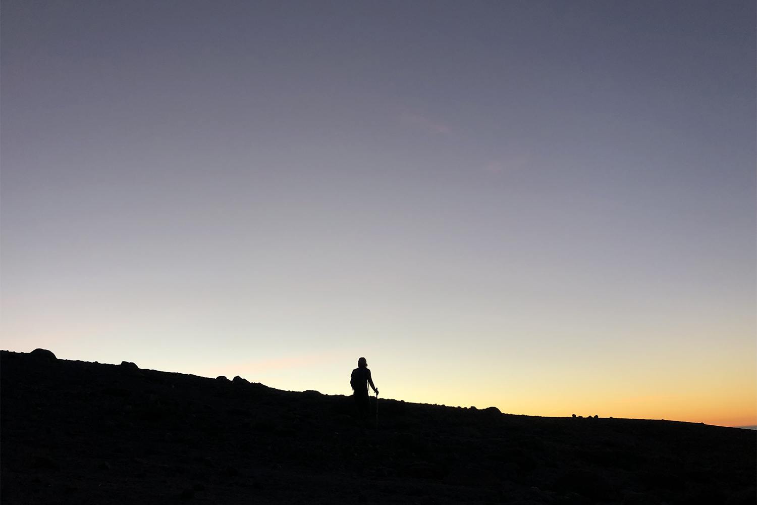 hiker at sunrise on mt. hood